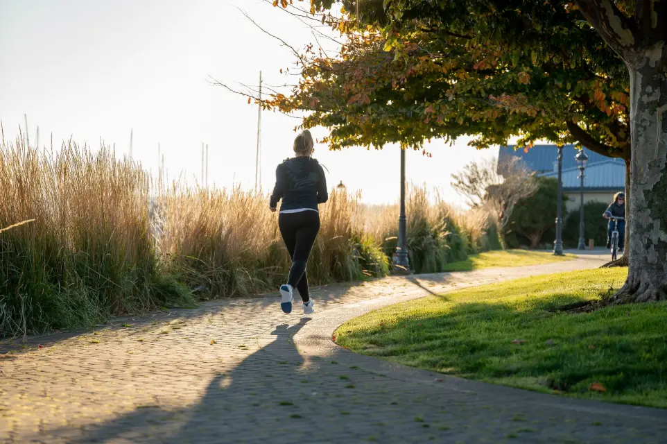 Woman running in StepCraft insoles.